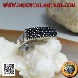 Silver ring with raised rectangular plate with large and small dots