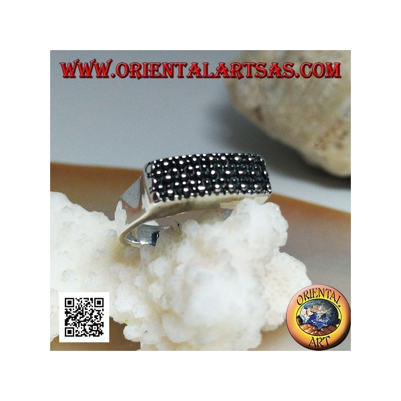 Silver ring with raised rectangular plate with large and small dots