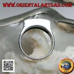 Silver ring with raised rectangular plate with large and small dots