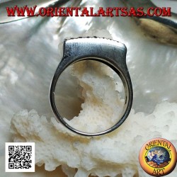 Silver ring with raised rectangular plate with large and small dots