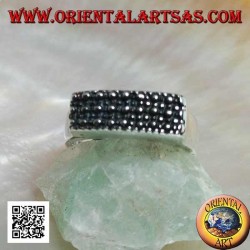 Silver ring with raised rectangular plate with large and small dots