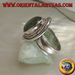 Silver ring with oval cabochon labradorite surrounded by intertwining on a smooth shield