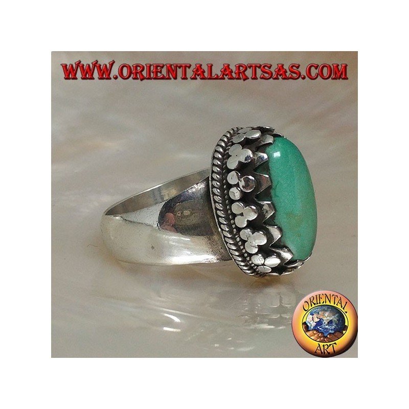Silver ring with natural Tibetan antique oval turquoise set with discs with lateral weave