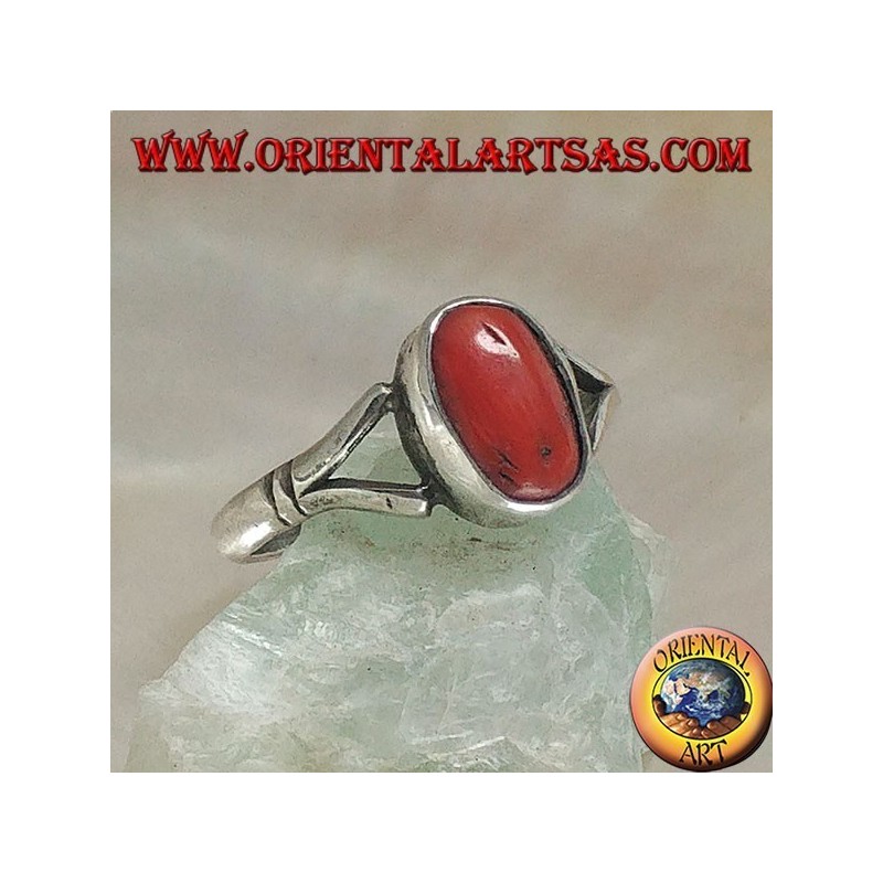 Silver ring with oval Tibetan antique coral hooked by two wires on a simple setting