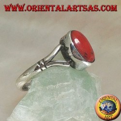 Silver ring with oval Tibetan antique coral hooked by two wires on a simple setting