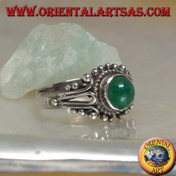 Silver ring with round green cabochon agate surrounded by interweaving and balls decoration
