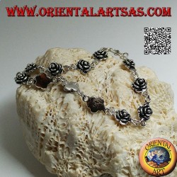 Soft silver chain bracelet with row of roses with plate underneath