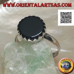 Silver ring with flat round onyx set with teeth on a simple setting