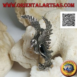 Silver brooch in the shape of a phoenix in flight in profile studded with marcasite and with a drop of onyx