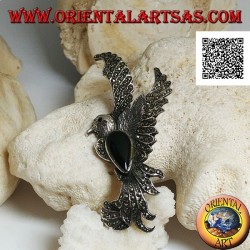 Silver brooch in the shape of a phoenix in flight in profile studded with marcasite and with a drop of onyx