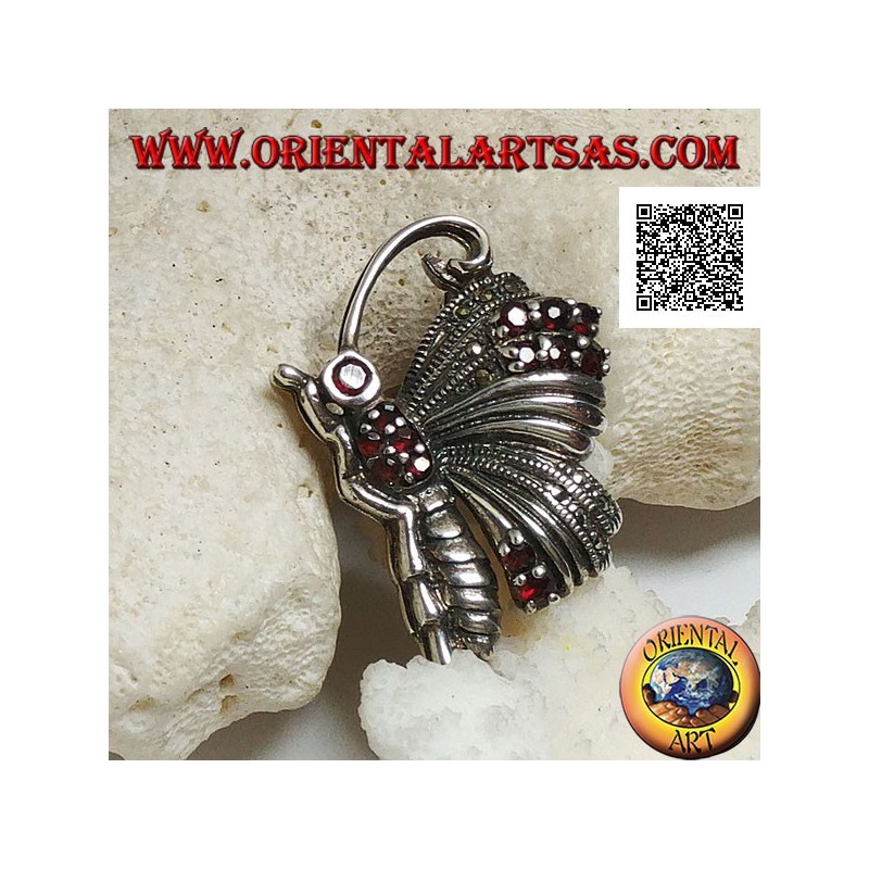 Broche en argent en forme de papillon de profil parsemé de marcassite et de grenats