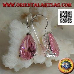 Dangling silver earrings with pink teardrop zircon set on a frame with lateral openings