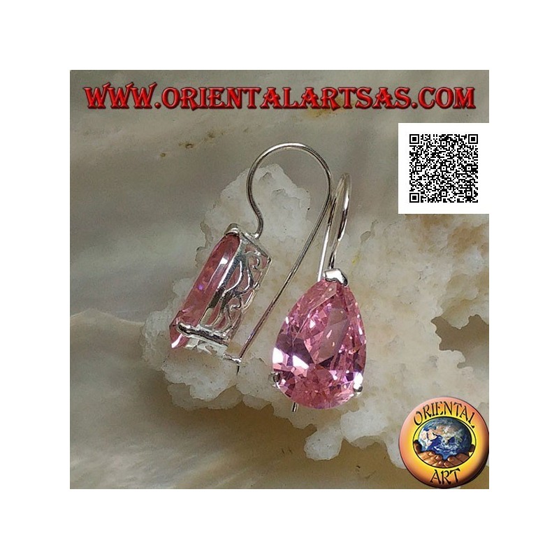 Dangling silver earrings with pink teardrop zircon set on a frame with lateral openings