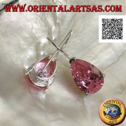 Dangling silver earrings with pink teardrop zircon set on a frame with lateral openings