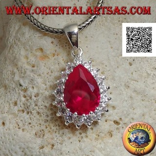 Silver pendant with drop-shaped ruby-colored zircon surrounded by white zircons