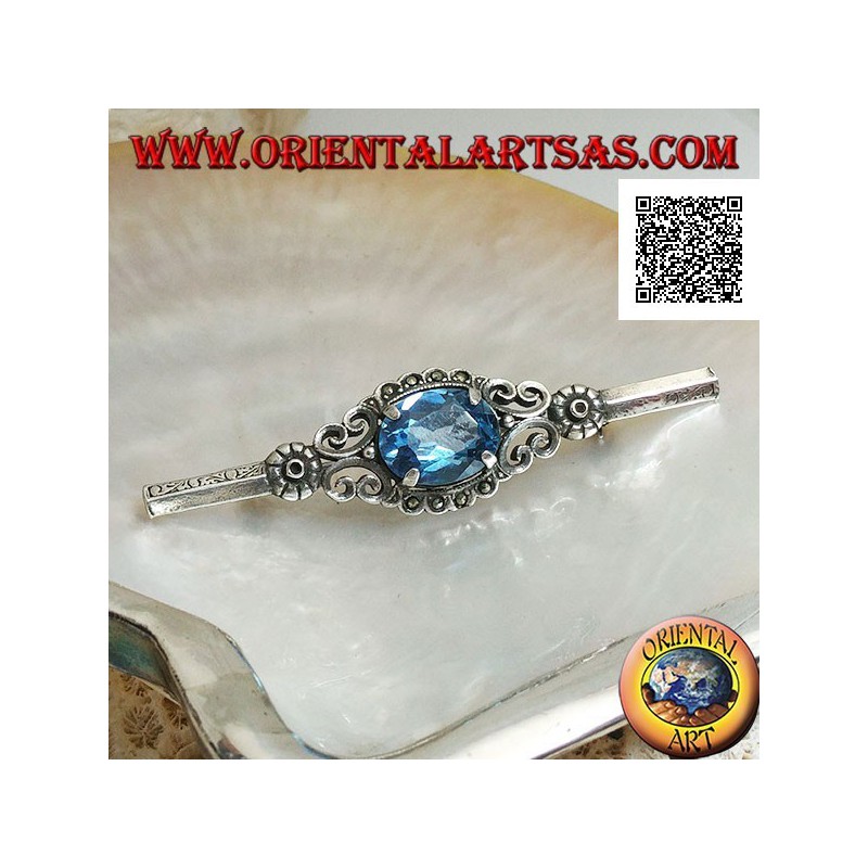 Silver brooch with blue topaz set surrounded by imperial decoration with marcasite on a stick