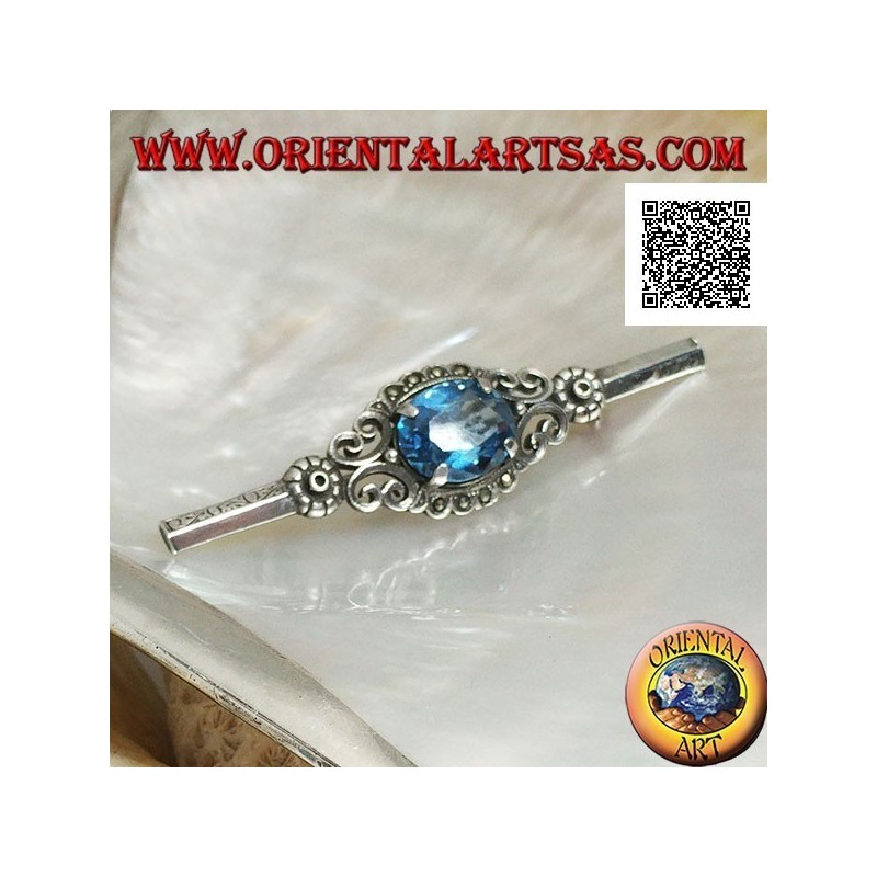 Broche de plata con conjunto de topacio azul rodeado de decoración imperial con marcasita en un palo