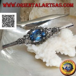 Silver brooch with blue topaz set surrounded by imperial decoration with marcasite on a stick