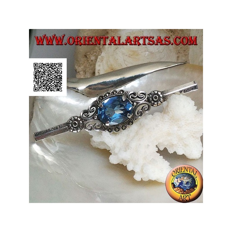Broche de plata con conjunto de topacio azul rodeado de decoración imperial con marcasita en un palo