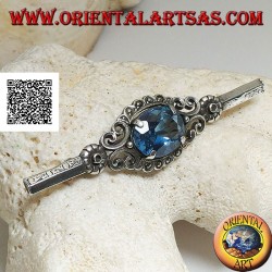 Silver brooch with blue topaz set surrounded by imperial decoration with marcasite on a stick
