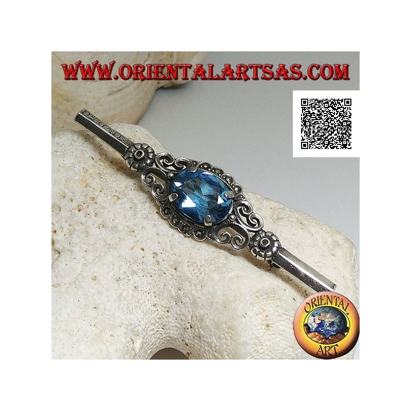 Silver brooch with blue topaz set surrounded by imperial decoration with marcasite on a stick