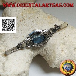 Silver brooch with blue topaz set surrounded by imperial decoration with marcasite on a stick
