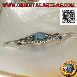 Silver brooch with blue topaz set surrounded by imperial decoration with marcasite on a stick