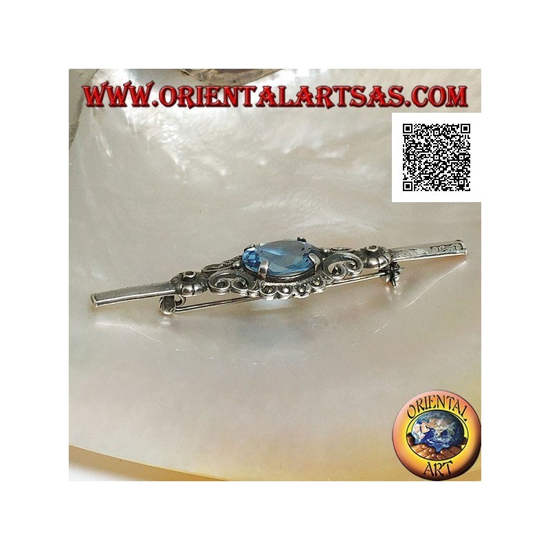 Silver brooch with blue topaz set surrounded by imperial decoration with marcasite on a stick
