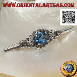 Silver brooch with blue topaz set surrounded by imperial decoration with marcasite on a stick