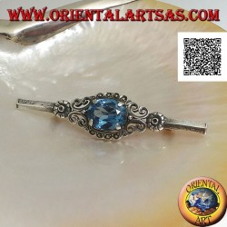 Silver brooch with blue topaz set surrounded by imperial decoration with marcasite on a stick