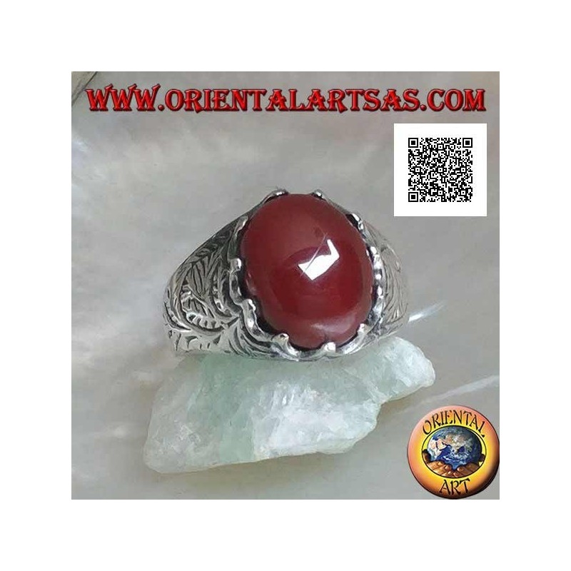 Silver ring with oval cabochon carnelian set and engraved decorations on the sides