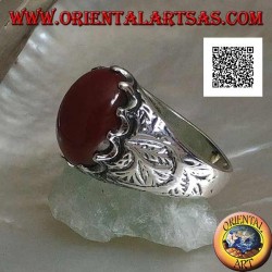 Silver ring with oval cabochon carnelian set and engraved decorations on the sides