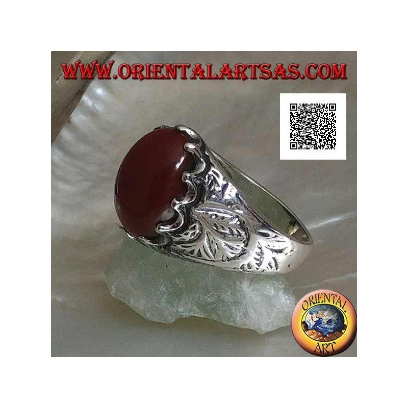 Silver ring with oval cabochon carnelian set and engraved decorations on the sides