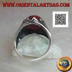 Silver ring with oval cabochon carnelian set and engraved decorations on the sides