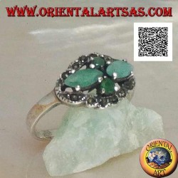 Silver ring with crossed cross pairs of natural shuttle emeralds and round ones surrounded by marcasite