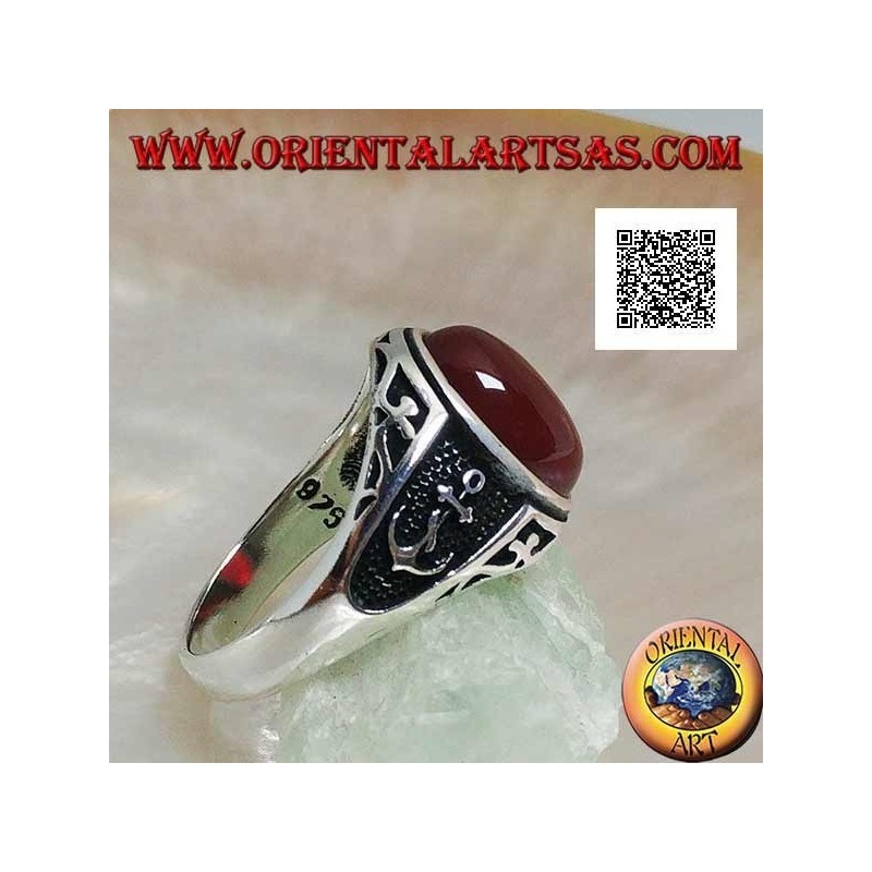 Silver ring with oval cabochon carnelian with engravings and still in relief on the sides