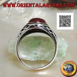 Silver ring with oval cabochon carnelian with engravings and still in relief on the sides
