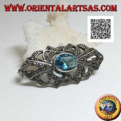 Silver brooch with oval blue topaz and openwork decoration studded with marcasite