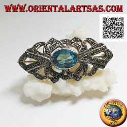 Silver brooch with oval blue topaz and openwork decoration studded with marcasite