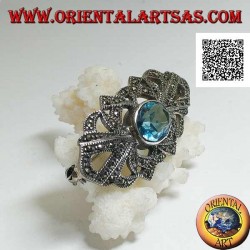 Silver brooch with oval blue topaz and openwork decoration studded with marcasite