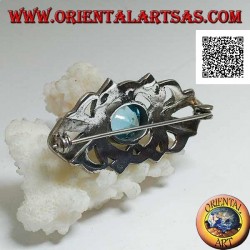 Broche de plata con topacio azul ovalado y decoración calada tachonada con marcasita
