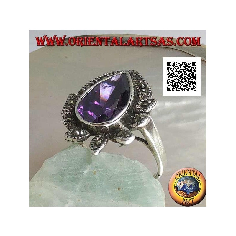 Anillo de plata con una gran gota de circón color amatista rodeado de hojas tachonadas de marcasita