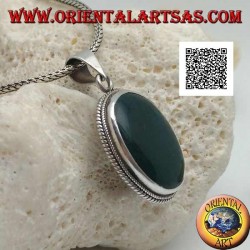 Silver pendant with green hematite or oval blood stone surrounded by a thin weave