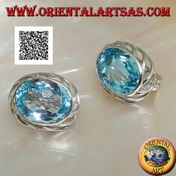 Silver lobe earrings with blue oval topaz on with openwork weave on the sides and lever closure