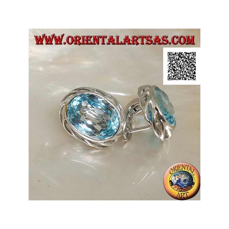 Silver lobe earrings with blue oval topaz on with openwork weave on the sides and lever closure