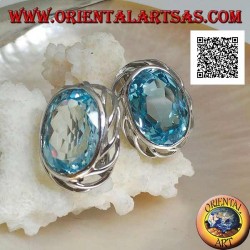 Silver lobe earrings with blue oval topaz on with openwork weave on the sides and lever closure