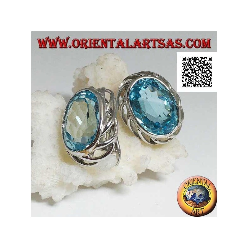 Silver lobe earrings with blue oval topaz on with openwork weave on the sides and lever closure