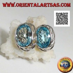 Silver lobe earrings with blue oval topaz on with openwork weave on the sides and lever closure
