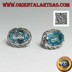 Silver lobe earrings with blue oval topaz on with openwork weave on the sides and lever closure
