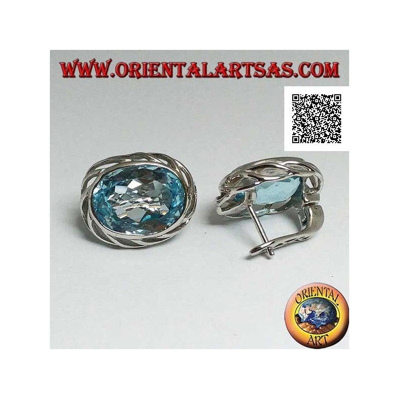 Silver lobe earrings with blue oval topaz on with openwork weave on the sides and lever closure